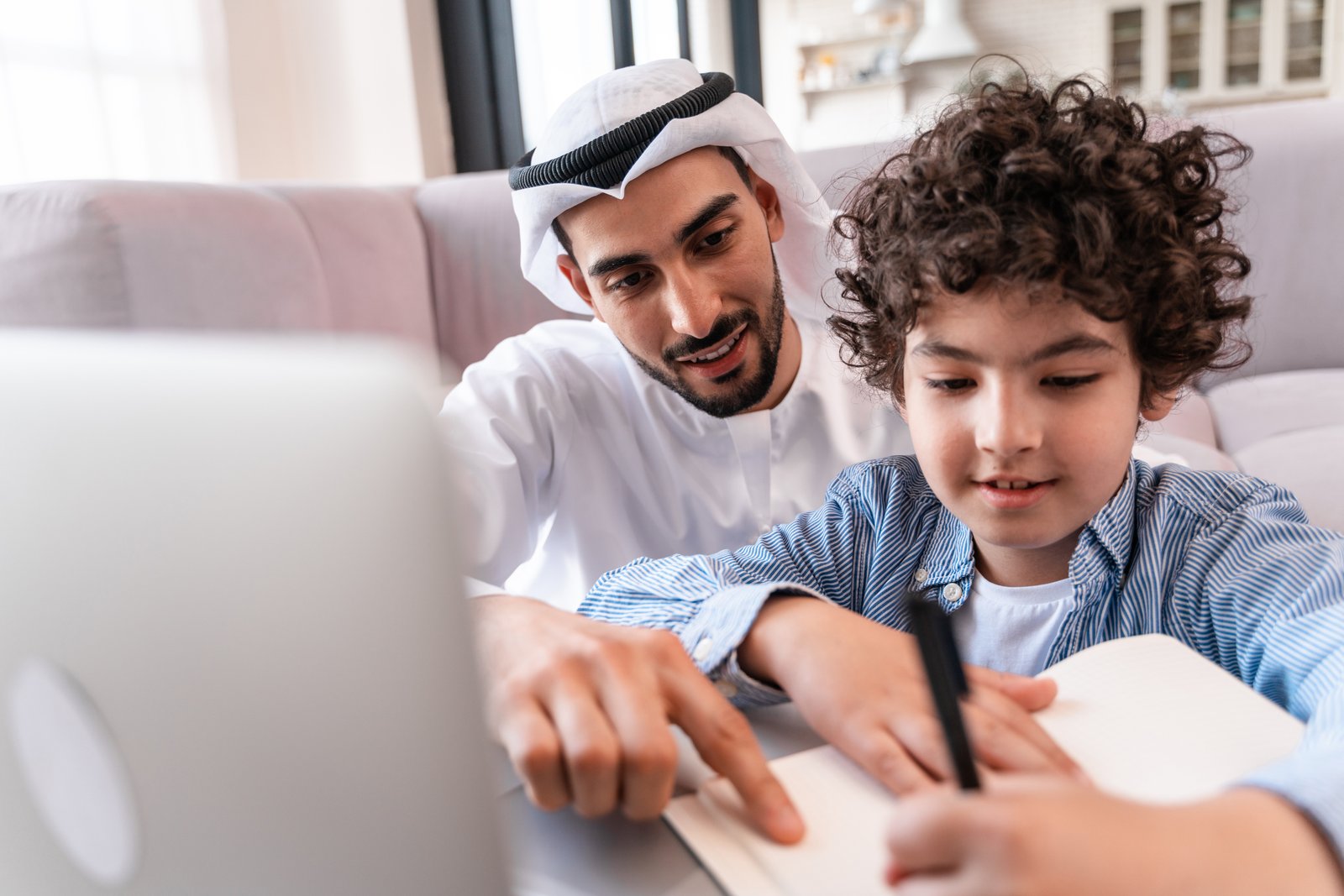 Family learning together with laptop for modern skills development